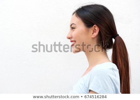 Foto d'archivio: Side Profile Of An Asian Young Woman Smiling