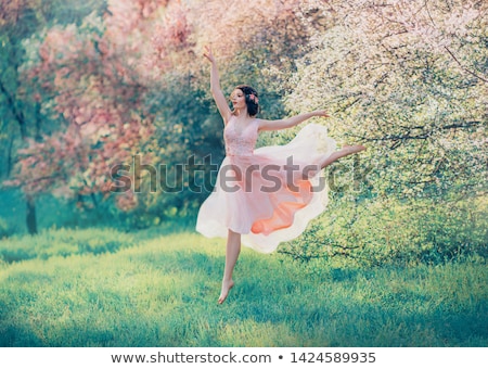 Stock fotó: Fabulous Young Woman With A Flower Hairstyle