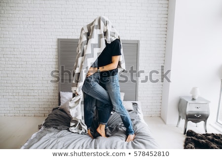 Foto stock: Two Lovers Under The Wall Of A Beautiful Interior