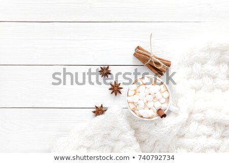 Foto stock: Cinnamon Sticks And Anise Star Closeup On White Wood Background
