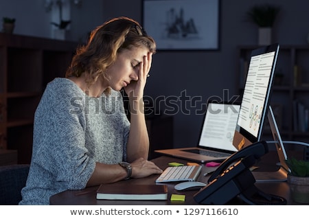 Stok fotoğraf: Exhausted Businesswoman Working Overtime On Office Laptop Comput