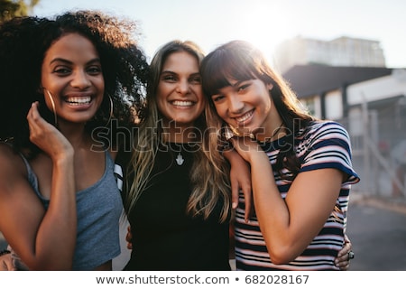 Stok fotoğraf: Three Young Good Girl Friend People In The City