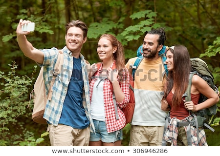 Foto d'archivio: Friends With Backpack Taking Selfie By Smartphone