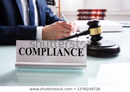 Stock fotó: Compliance Name Plate Over Reflected Desk