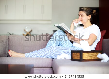 ストックフォト: Sad Woman Reading The Book Holding Paper Napkins