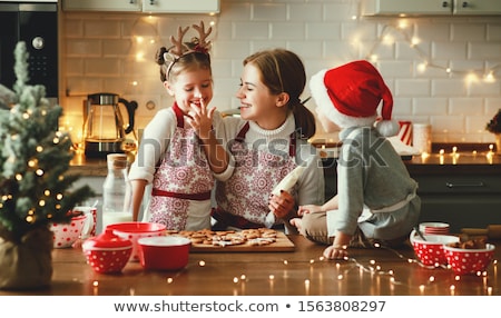 Foto d'archivio: Beautiful Woman Is Baking Cookies For Christmas