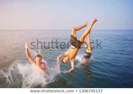 Foto stock: Jumping Off Rock Silhouette