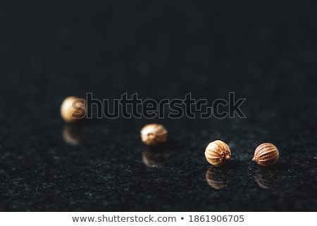 Foto stock: Front View Of Bowl Of Organic Dried Coriander Seeds