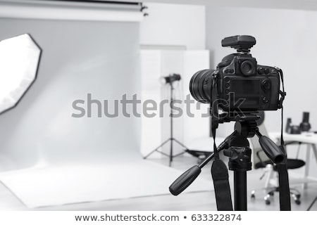 Foto d'archivio: Photographer With Camera In Photo Studio