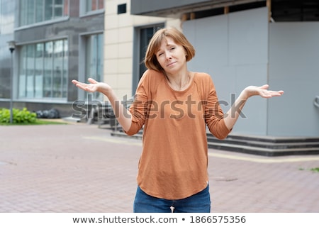 Stockfoto: Caucasian Confused Business Woman With Spread Arms