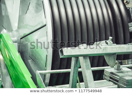 Stock fotó: Agricultural Irrigation Spool Hose As Abstract Background