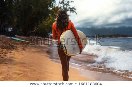 Foto stock: Portrait Of Happy Man Carrying Surfboard