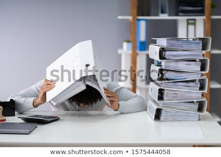 Foto d'archivio: Businessman Hiding Under Folder
