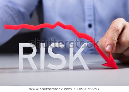 Stock photo: Person Pointing Diminishing Arrow Over The Risk