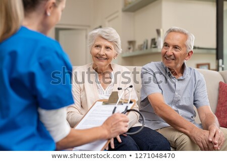 Stock foto: Doctor And Patient Senior Couple