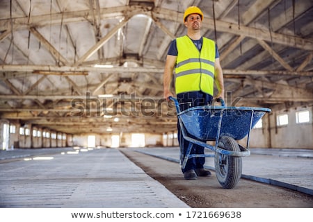 Stock fotó: Builder With A Wheelbarrow