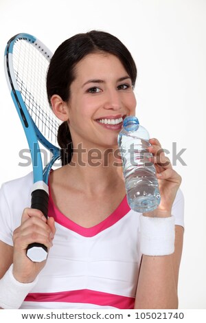 Foto stock: A Tenniswoman Having A Sip Of Water