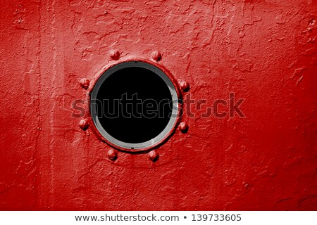 Porthole On Red Wall Of Old Ship Stockfoto © pzAxe