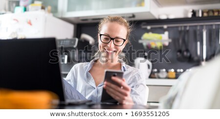 ストックフォト: Business Woman Working From Her Kitchen