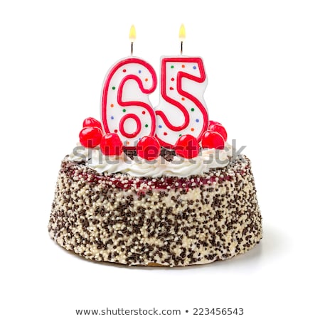 Foto stock: Birthday Cake With Burning Candle Number 65