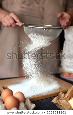 Stok fotoğraf: Hands Sifts Almond Flour For Cake Baking