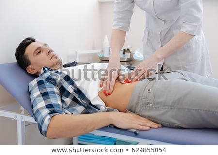 Zdjęcia stock: A Man Experiencing Pain At The Stomach