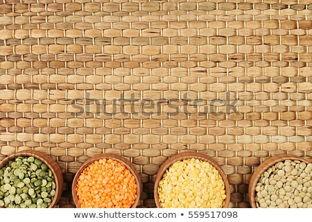 Stockfoto: Assortment Of Lentils In A Wooden Bowls With Copy Space On Bamboo Mat Background Top View Closeup