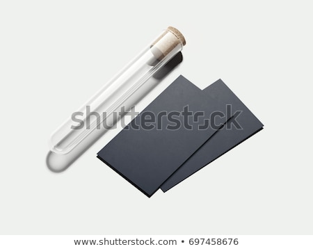 [[stock_photo]]: Clean Beaker With Balck Business Cards 3d Rendering