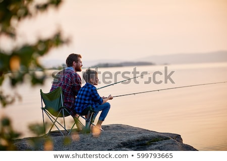 Foto stock: Fishers At Sunset