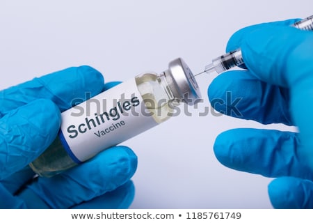 Foto stock: Doctor Filling Shingles Vaccine Syringe