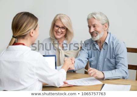 Foto stock: Manager Working As Banking Broker With Old Man Signing Contract