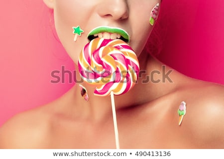 Stockfoto: Beautiful Young Woman Holds In Hands Candy Smiling Broadly Stylish Girl With Bright Makeup And Cand