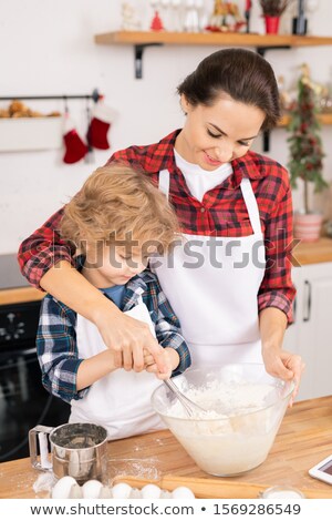 Stock fotó: Young Female Helping Her Son Whisk Eggs With Flour In Bowl While Preparing Dough