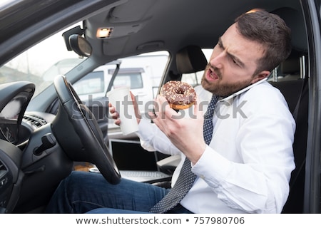 Foto stock: Man Taking A Call At Breakfast