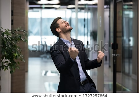 Сток-фото: Enthusiastic Corporate Man Clenching Fist