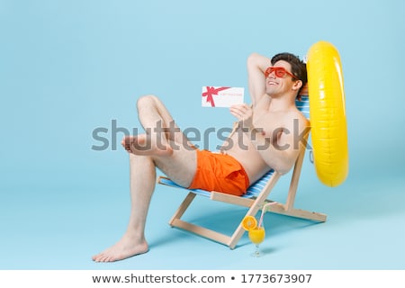 Stock fotó: Young Man Gestures At The Beach