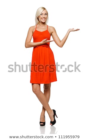 Foto stock: Young Beautiful Girl In Red Dress Pointing Isolated On White