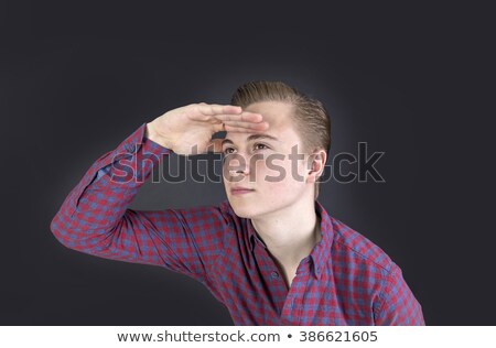 [[stock_photo]]: Cute Sixteen Year Old Boy In Studio Looking Into The Far