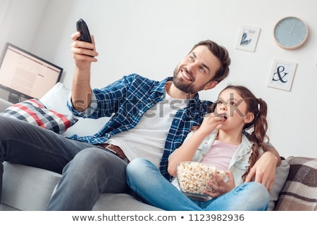 Stock photo: Little Girl Holding Remote Controller