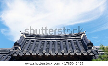 Сток-фото: Roof Tiles And Sky With Clouds At Sun Day