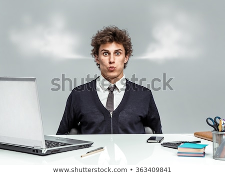 Stockfoto: Angry Young Man Blowing Steam Coming Out Of Ears