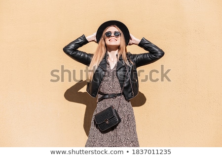 Stylish Woman In Fashionable Beige Dress Standing Near Leather Bag Stok fotoğraf © Alones