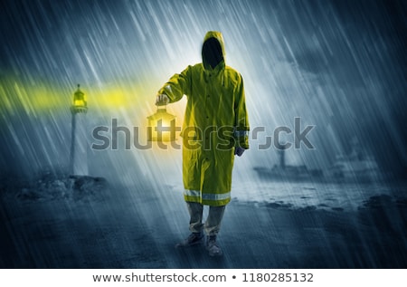 Stock fotó: Man Coming With Lantern At Coast Concept