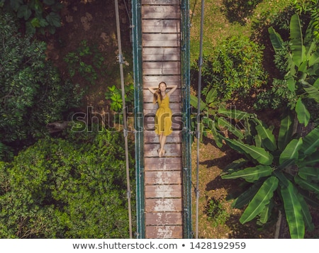 Foto stock: Young Woman At The Suspension Bridge In Kuala Lumpur Malaysia