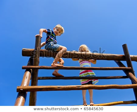 Сток-фото: A Two Boys On Playground Climbing Frame
