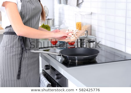 Stok fotoğraf: Woman Housewife With A Frying Pan