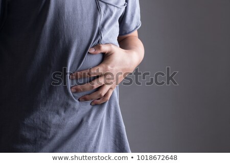 Stockfoto: Man In Pain Holding His Stomach