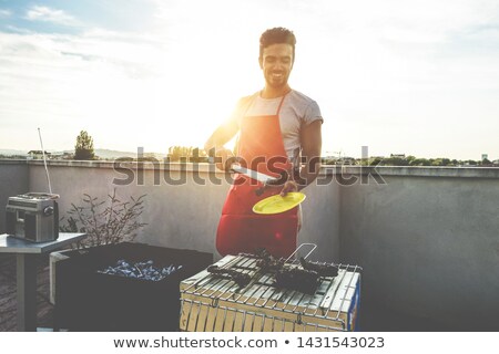 Young Man And His Barbecue Foto stock © DisobeyArt