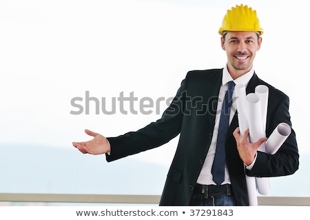 Handsome Young Architect In Suit With Blueprints [[stock_photo]] © dotshock