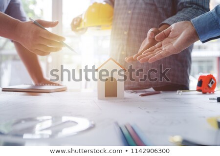 Stock photo: Architects Evaluating A Building Model